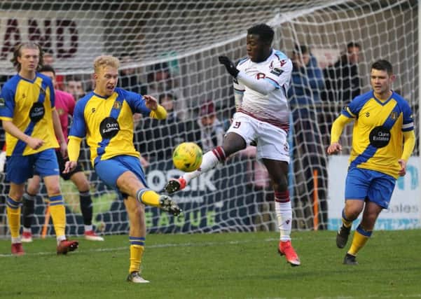 Daniel Ajakaiye gets his foot to the ball ahead of an opponent during Hastings United's 5-0 win at home to Sittingbourne last weekend. Picture courtesy Scott White
