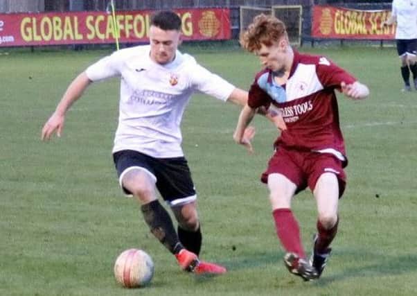 Oliver Weeks keeps a close eye on the Pagham player in possession. Pictures courtesy Roger Smith