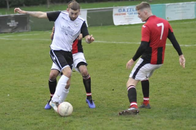 Bexhill United goalscorer Nathan Lopez on the ball