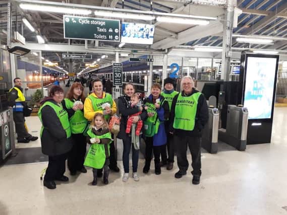 Samaritans getting ready to hand out teabags at Eastbourne station for Brew monday in 2018