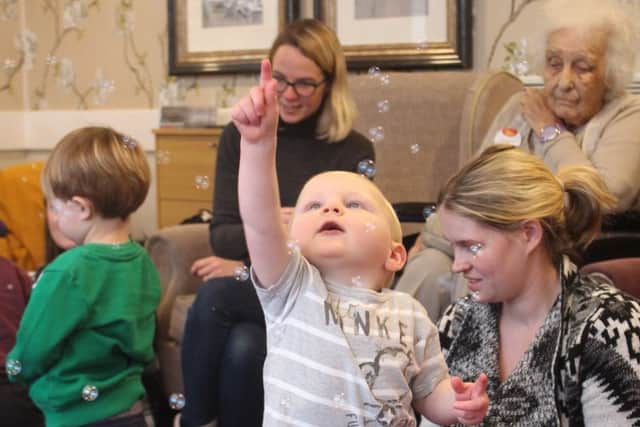 Delighting in the bubbles as part of the intergenerational activities
