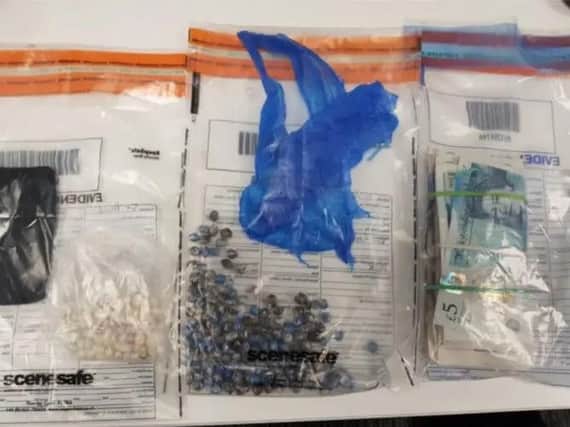 Police seized cash and drugs from a woman in Brighton