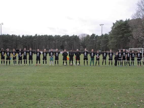 The players line up before the game
