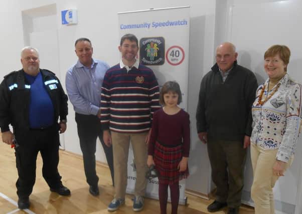Sophia Wilton presenting equipment to Thakeham Speedwatch, joined by parish councillors and police.