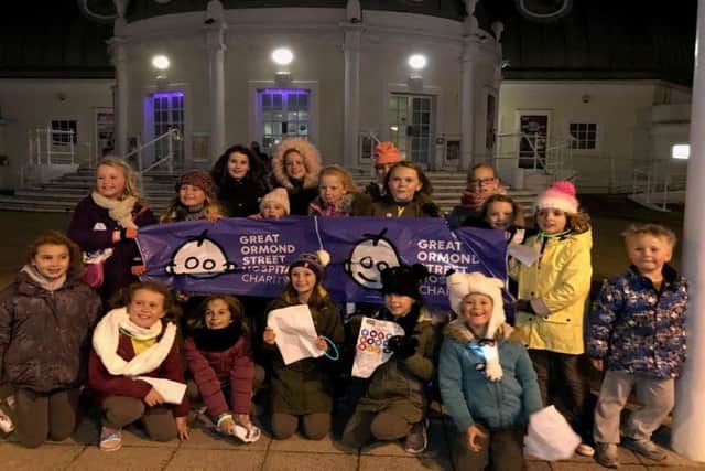 Leaders and young members of 2nd Lancing Brownies atop off at the Pavilion Theatre in Worthing on their sponsored walk
