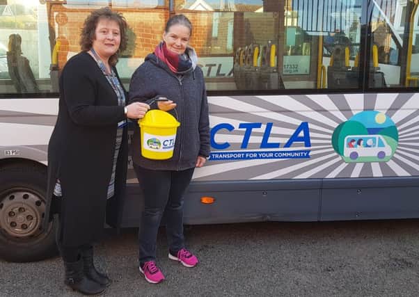 CTLA customer advisor Lucy receives the funds from Caroline Counihan