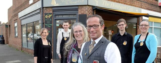 Owner Michael Crayton and his mother Elizabeth with the team outside the cafe. Picture: Kate Shemilt ks190018-1