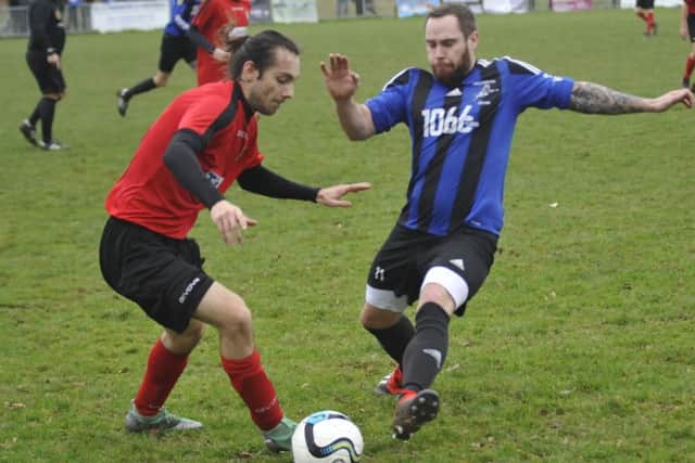 Hollington United and Sedlescombe Rangers tussle for possession