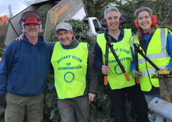 Storrington & Pulborough District Rotary Club held its Christmas tree recycling scheme for a second year. Pictured left to right:  Rob Dakin, Mike Webster and Malcolm and Jane Gray SUS-190116-113514001