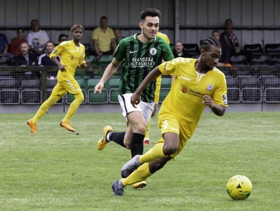Potters Bar, in yellow, in action at Burgess Hill earlier in the season / Picture by Chris Neal