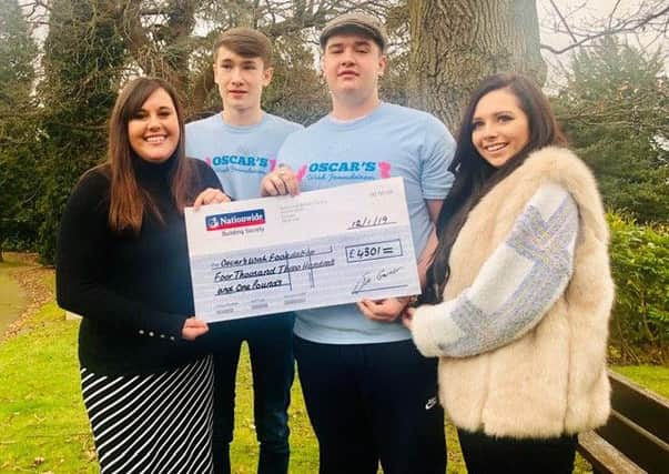 From left: Gemma Kybert, Oliver, Owen and Lauryn with their cheque