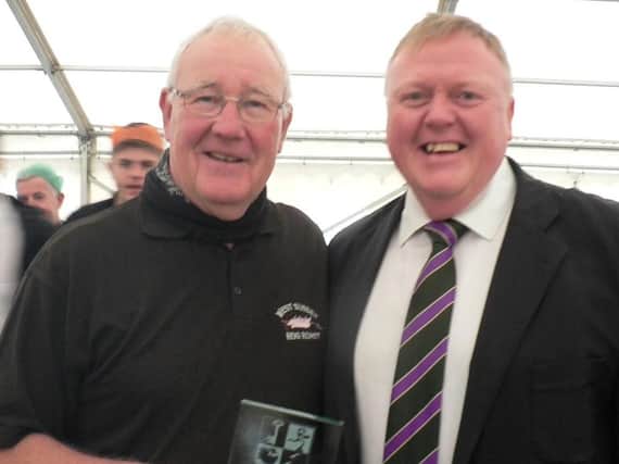 Tony Fitzpatrick receives the award from John Donoghue at Bognor RFC