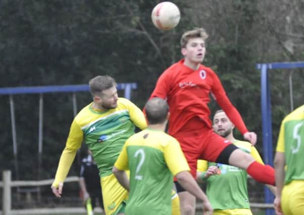 Westfield chairman Jack Stapley goes up for a header during the last home game, against Littlehampton United, 12 days ago