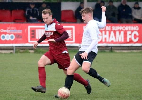Little Common wide player Sam Ellis closes down a Pagham opponent during last weekend's 2-2 draw. Picture courtesy Roger Smith