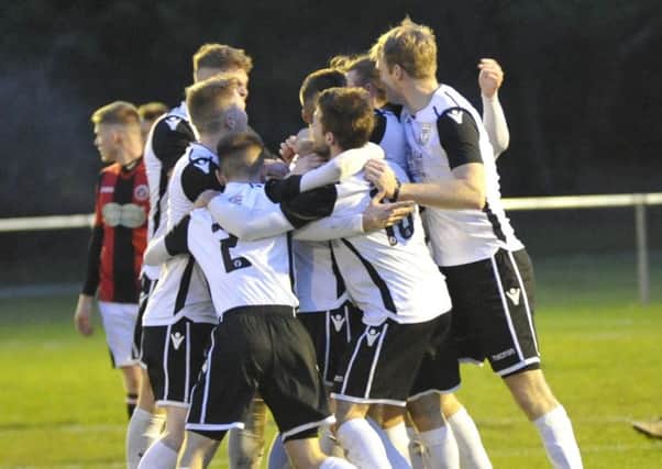 Bexhill United celebrate after taking the lead in the 1-1 draw at home to AFC Varndeanians