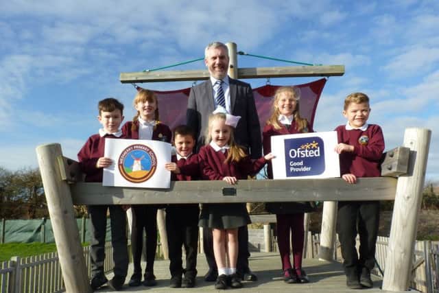 Michael Tidd, headteacher at Medmerry Primary School, celebrating Ofsted success with pupils