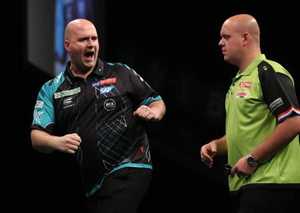 Rob Cross celebrates during his semi-final match against Michael van Gerwen at the 2018 Unibet Premier League Play-Offs. Picture courtesy Lawrence Lustig/PDC
