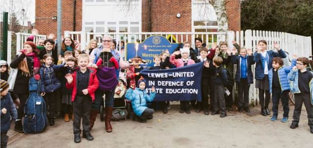 Parents and pupils at Western Road Community Primary School celebrate the withdrawal. Photograph by Sarah Weal