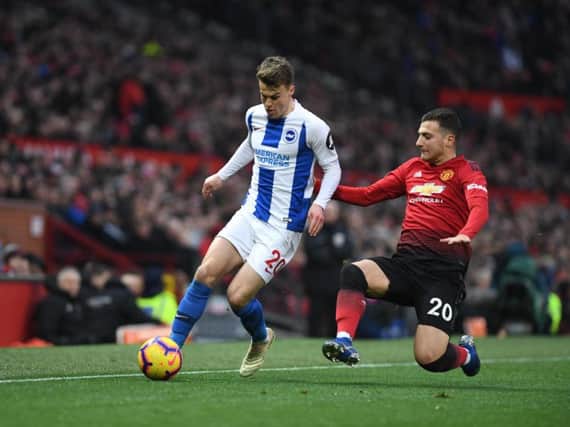 Brighton's Solly March attempts to burst past Man United's Diogo Dalot. Picture by PW Sporting Photography.