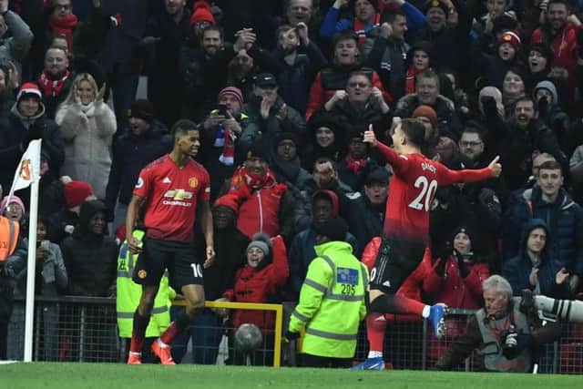 Marcus Rashford celebrates United second goal on his 150th appearance with Diogo Dalot. Picture by PW Sporting Photography.