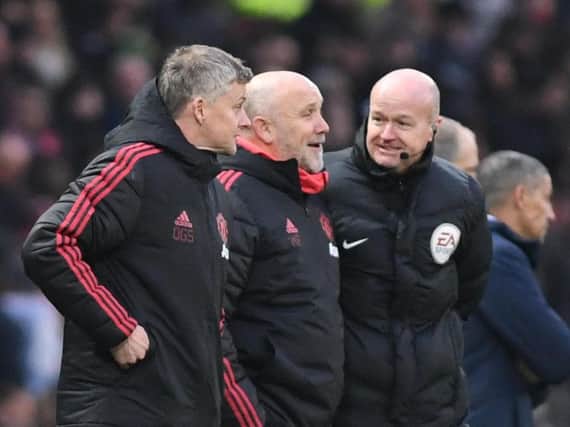 Manchester United caretaker manager Ole Gunnar Solskjaer (left) and assistant manager Mike Phelan (centre). Picture by PW Sporting Photography.