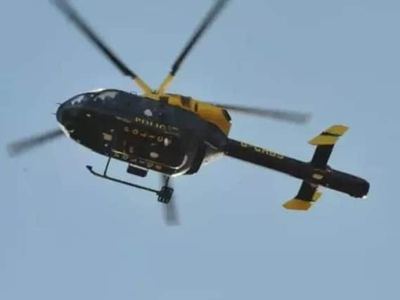 The police helicopter was seen circling the skies above Crawley