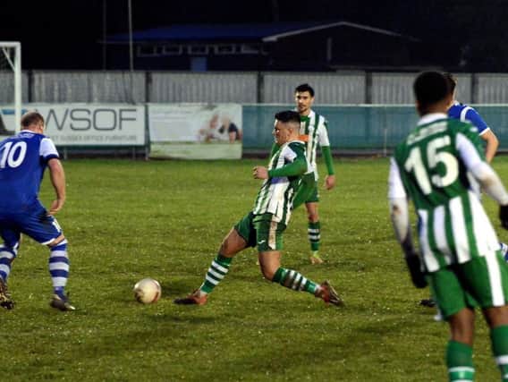 Josh Clack tries to take control for City against Saltdean / Picture by Kate Shemilt