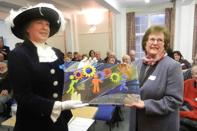 High Sheriff of West Sussex, Mrs Caroline Nicholls, and Worthing  deputy mayor Hazel Thorpe unveil the Voluntary Action Worthing glass window