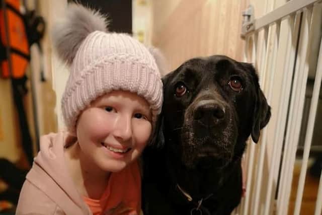 Keira Campbell, 13, from Goring, with her beloved labrador Busby