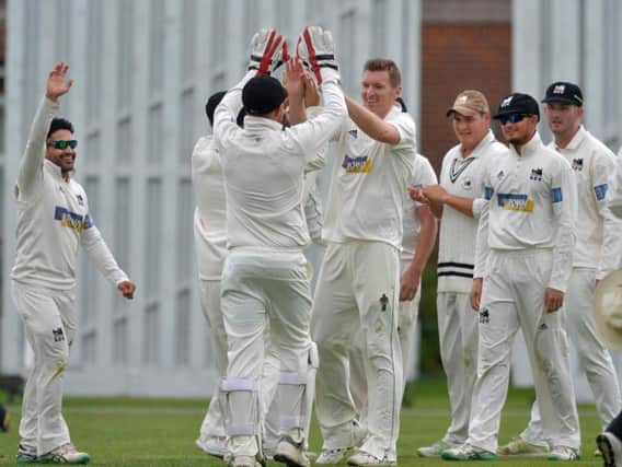 Roffey celebrate a wicket in the game against Eastbourne which clinched them the Sussex Cricket League title last season. Picture by Jon Rigby