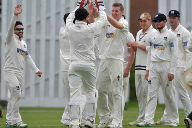Roffey celebrate a wicket in the game against Eastbourne which clinched them the Sussex Cricket League title last season. Picture by Jon Rigby