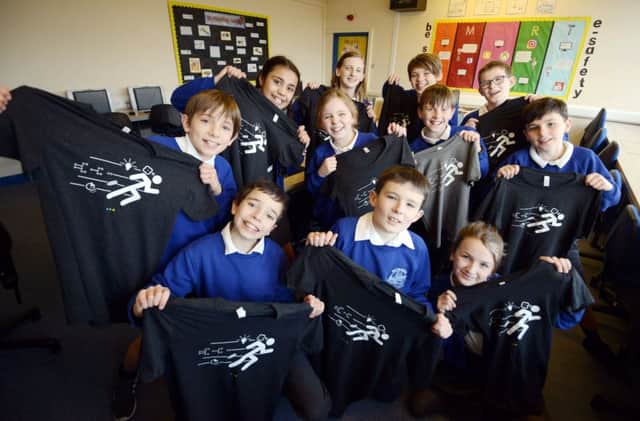ks190024-1 Petworth Primary App phot katePupils at Petworth Primary school who have won support from a tech  company by designing apps, here with the t shirts they were given.ks190024-1 SUS-190121-191313008