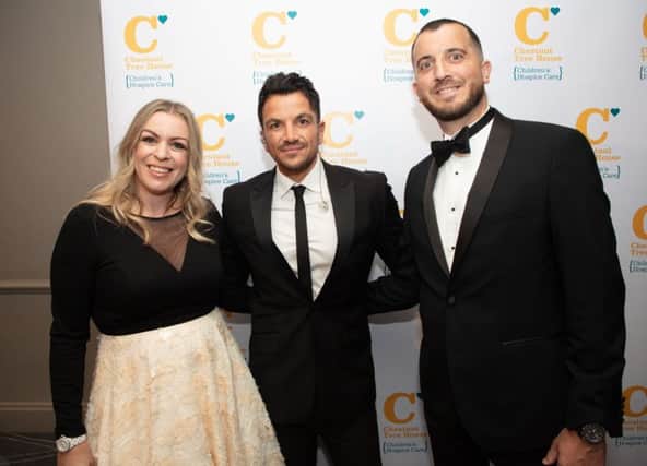 Peter Andre with Lorna (parent speaker) and Steve Cobbett at Chestnut Tree House fundraising ball SUS-190122-174011001