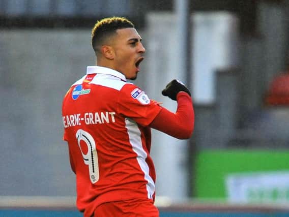 Karlan Ahearne-Grant celebrates one of his Crawley Town goals