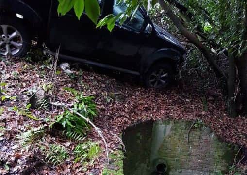 A car left a road near Cowfold. Photo by Horsham Police
