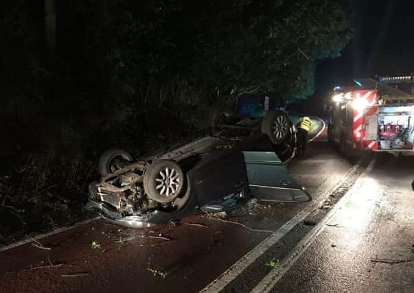 A car fliiped on its roof in a crash along the A272 near Wisborough Green. Photo by Billingshurst Fire Station