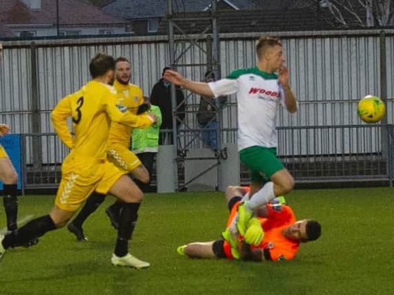 Mason Walsh is fouled for the penalty that put Bognor two up against Potters Bar / Picture by Tommy McMillan