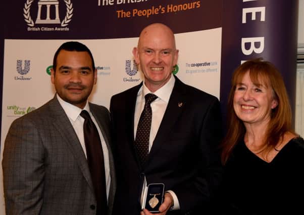 Founder of Checkatrade, Kevin Byrne, was honoured with a British Citizen Award for Services to Business at the Palace of Westminster on January 24. Picture: Event host Michael Underwood, Kevin Byrne and Lindsey Podolanski. Photo by Mark Hakansson