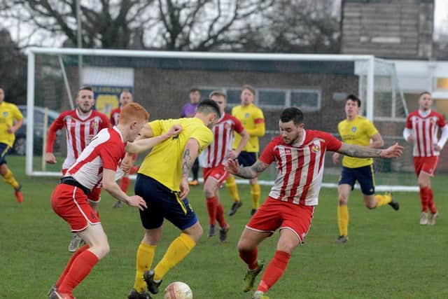 The yellow shirts of Sidlesham in action at home to Steyning / Picture by Kate Shemilt