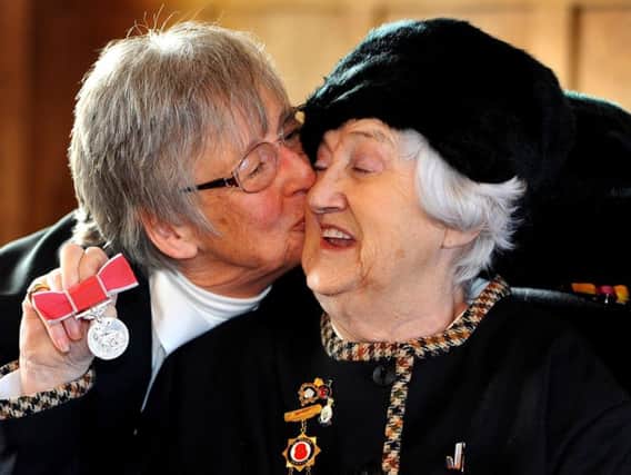 Daphne Snowden with a friend after accepting her British Empire Medal. Picture: Steve Robards