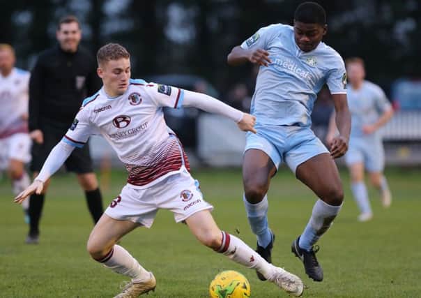 Hastings United midfielder Adam Lovatt tussles for possession during last weekend's 3-0 win at home to Whyteleafe. Picture courtesy Scott White