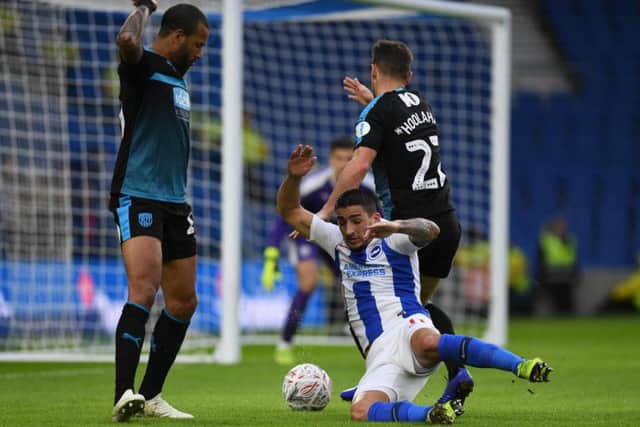 Anthony Knockaert goes down in the box after pressure from Tyrone Mears and Wes Hoolahan.