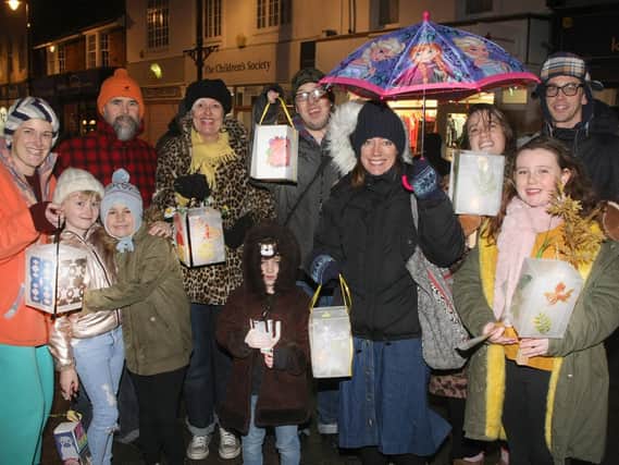 Residents gather with their lanterns.