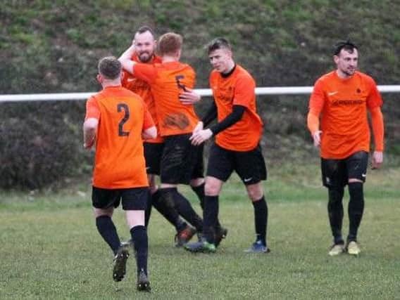 Mile Oak celebrate a goal in the win over Worthing United