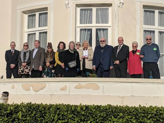 The congregation at Beach House in Worthing after three restored plaques were unveiled