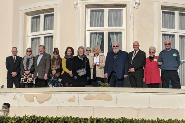 The congregation at Beach House in Worthing after three restored plaques were unveiled
