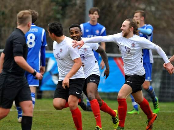 Ollie Gill is chased by Tony Nwachukwu and Jack Hartley after his opening goal in Horsham YMCA's 3-3 draw with Saltdean United. All pictures by Steve Robards.
