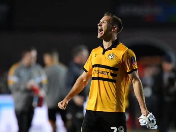 Mickey Demetriou celebrates Newport's win over Leicester - now he has a replay at home to Middlesbrough to look forward to / Picture by Getty Images