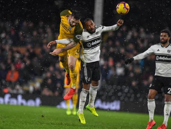 Brighton defender Shane Duffy challenges for a header at Fulham. Picture by PW Sporting Photography