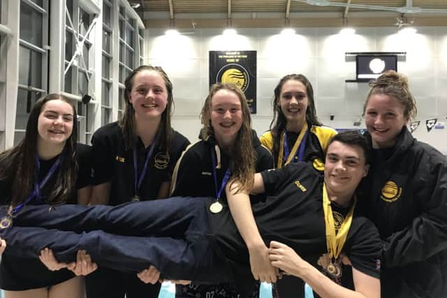 Atlantis' double junior county champions Emma Harrison, Mille Weeden, Jess Glassford, Amber Ranson and Issy Hayes with senior 1,500m champion Oliver Etheridge